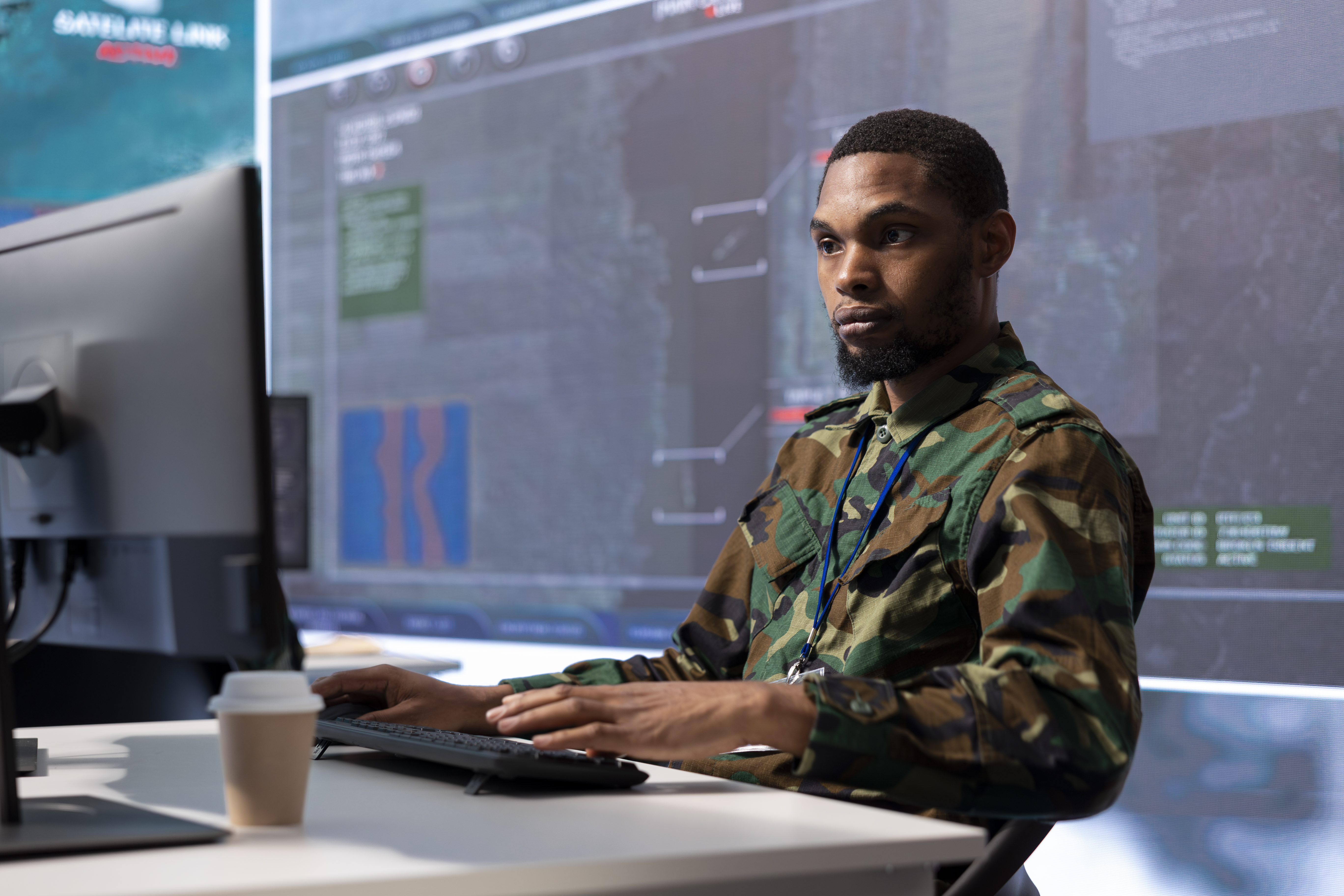 Military personnel in a high-tech control center processing critical information
